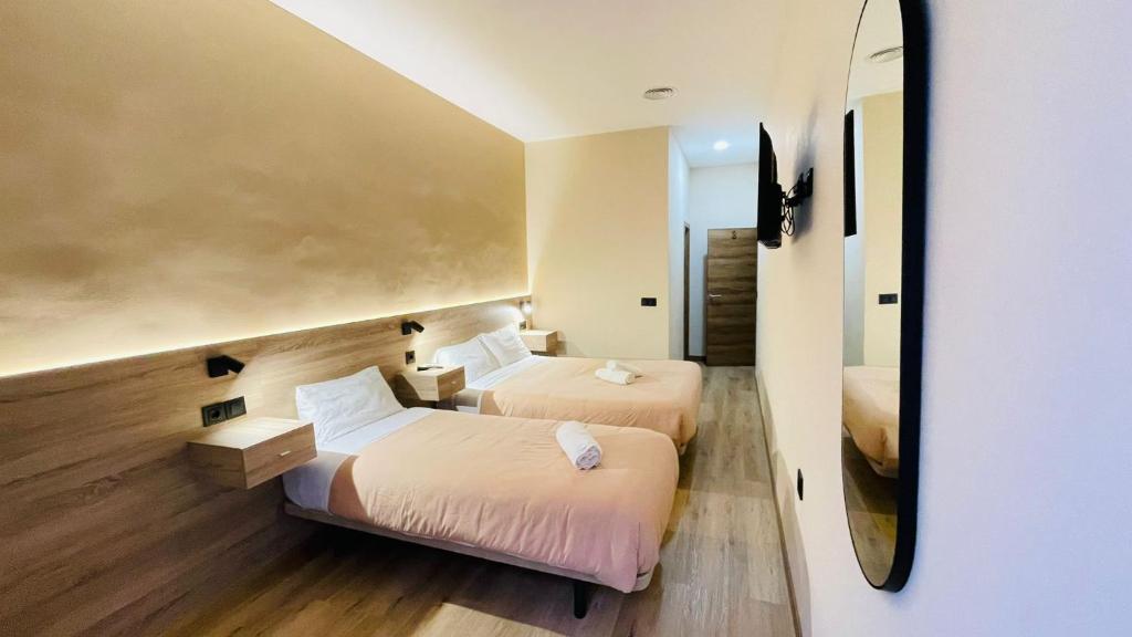 Postel nebo postele na pokoji v ubytování OPTIMUS COMFORT Campoamor 101