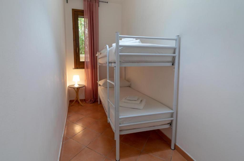 Rúm í herbergi á Residence Favignana