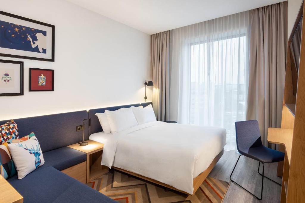 Postel nebo postele na pokoji v ubytování Hampton By Hilton Tallinn