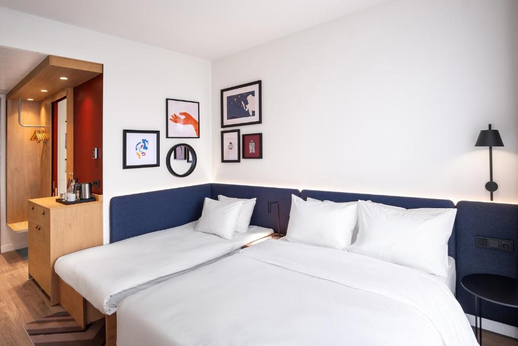 Postel nebo postele na pokoji v ubytování Hampton By Hilton Tallinn