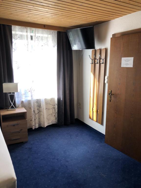 Postel nebo postele na pokoji v ubytování Hotel Weismann