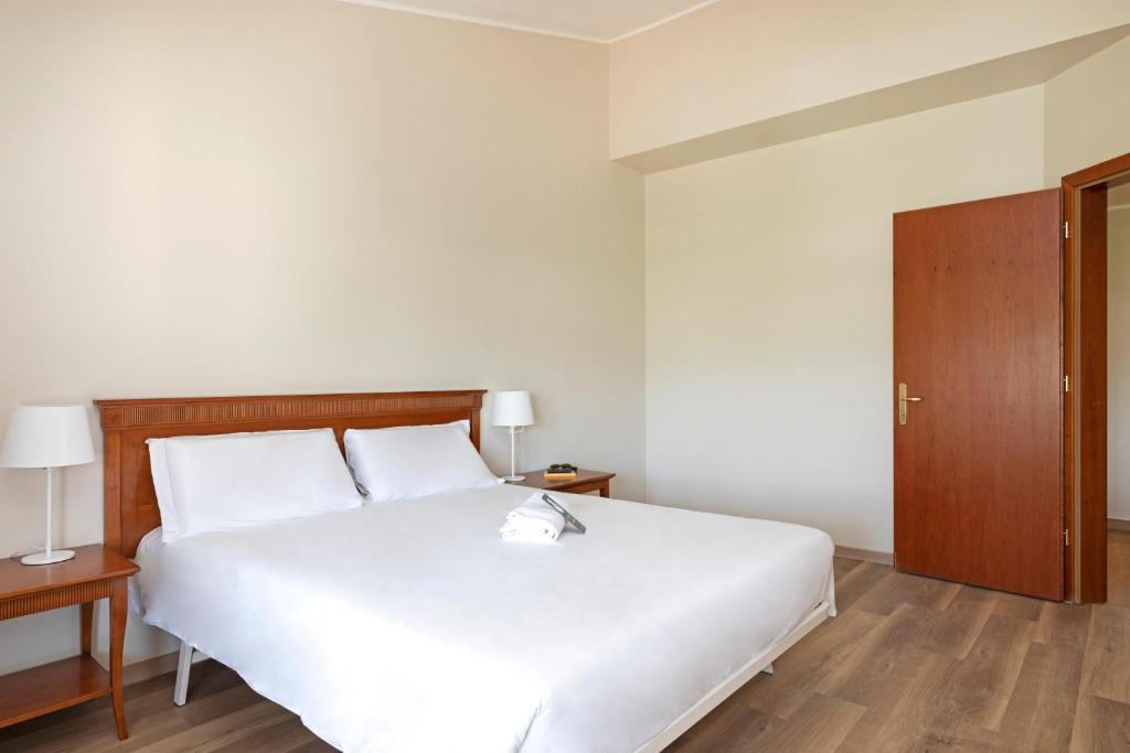 Letto o letti in una camera di B&B Hotel Affi - Lago di Garda