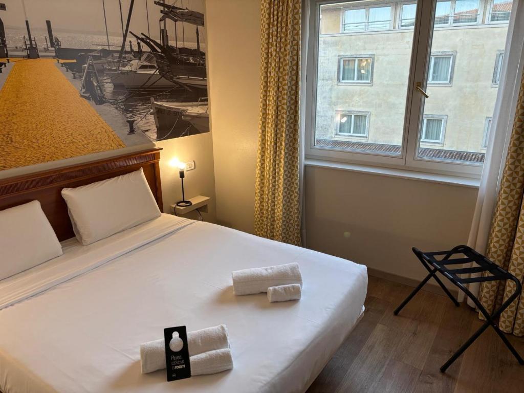 Letto o letti in una camera di B&B Hotel Affi - Lago di Garda