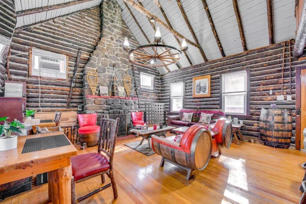 a living room with a stone wall at The Rustic Cabin in Blakeslee