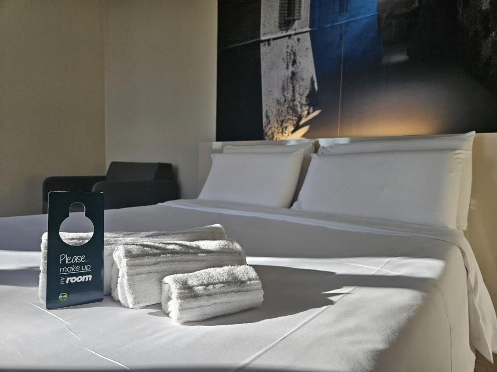 Postel nebo postele na pokoji v ubytování B&B HOTEL Mantova