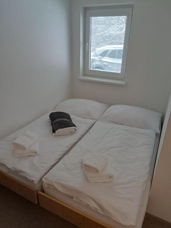 Postel nebo postele na pokoji v ubytování Hotel Bečva na Horní Bečvě