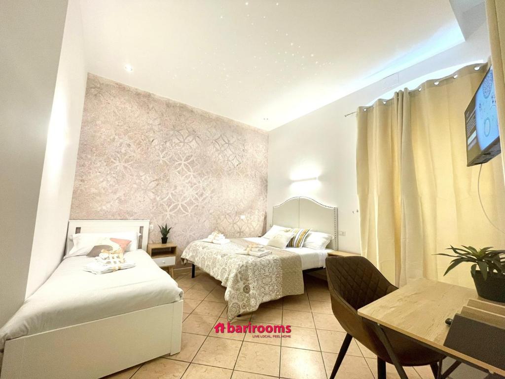 Postel nebo postele na pokoji v ubytování BARI ROOMS Abate Gimma