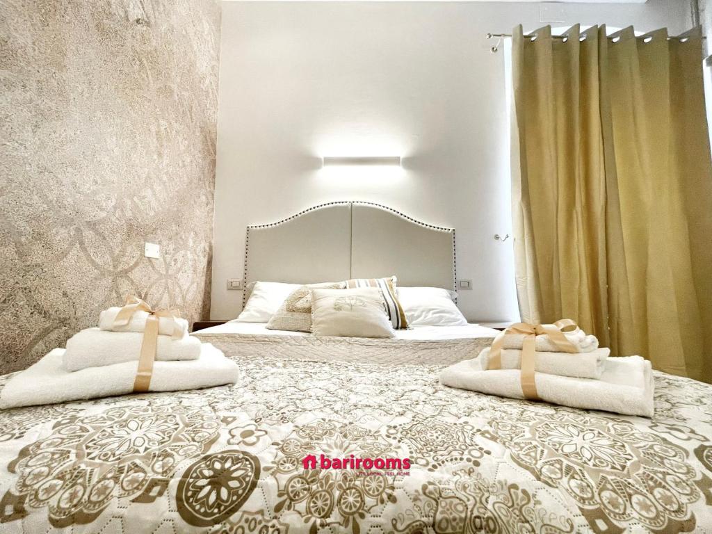 Postel nebo postele na pokoji v ubytování BARI ROOMS Abate Gimma