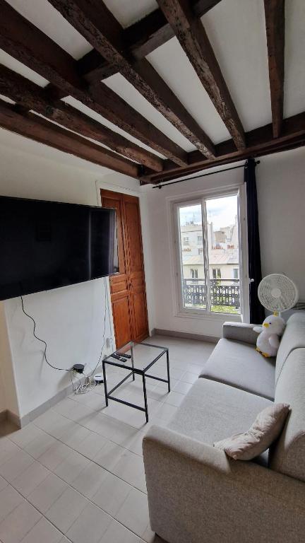 Photo de la galerie de l'établissement Cosy 1-bedroom apartment - Paris 17, à Paris
