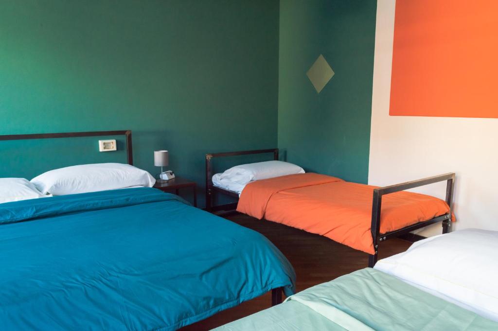 Postel nebo postele na pokoji v ubytování OStellin Genova Hostel