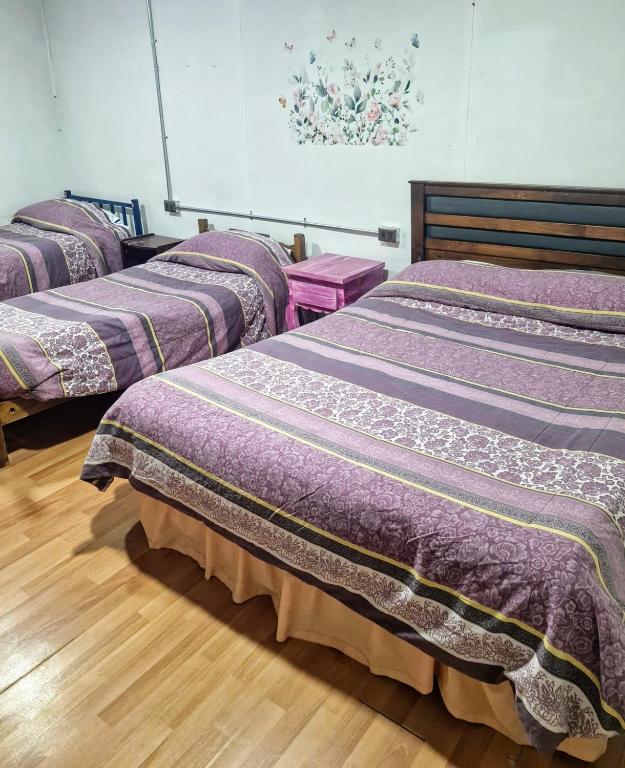 Cama o camas de una habitación en Hostal Arrayan