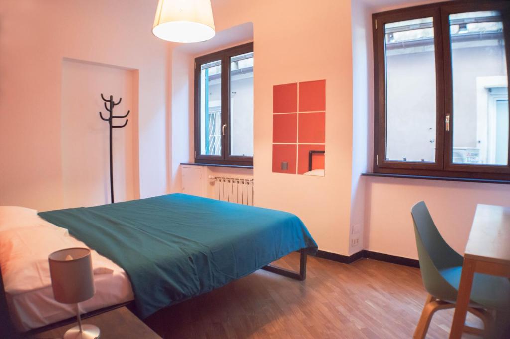 Postel nebo postele na pokoji v ubytování OStellin Genova Hostel