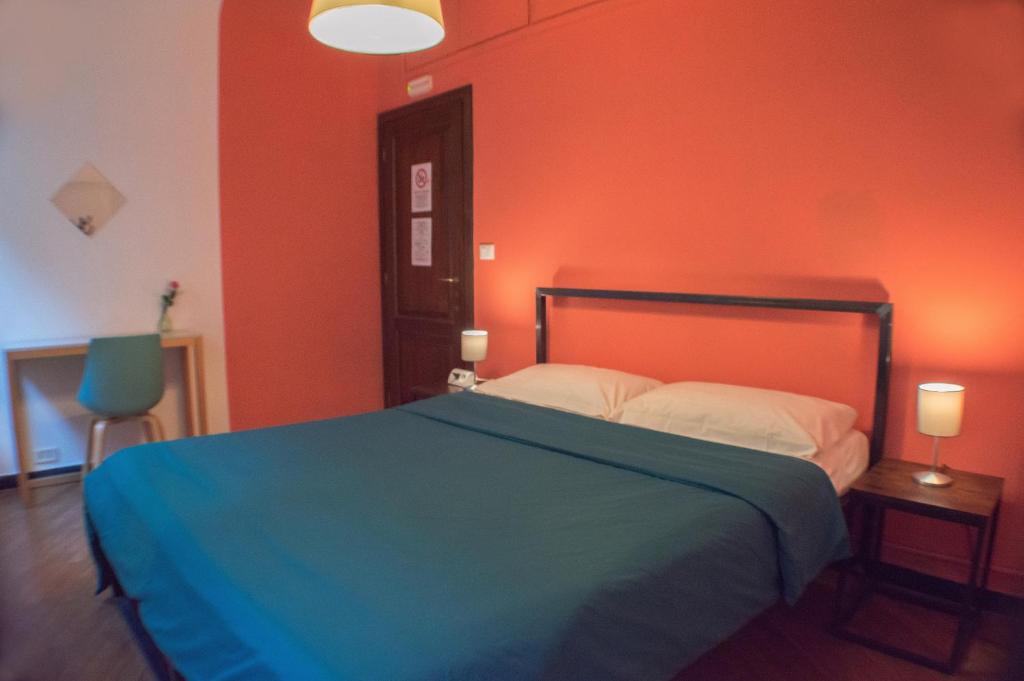 Postel nebo postele na pokoji v ubytování OStellin Genova Hostel