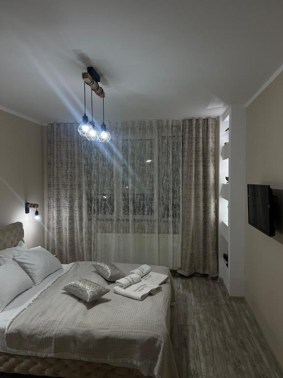 Postel nebo postele na pokoji v ubytování Apartman Trg Lux