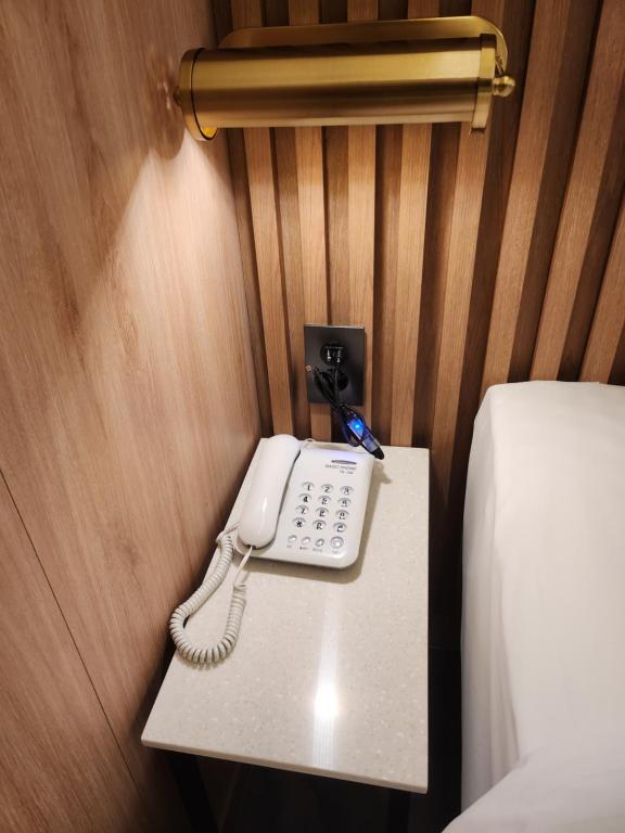 Postel nebo postele na pokoji v ubytování Suwon Hotel Insta