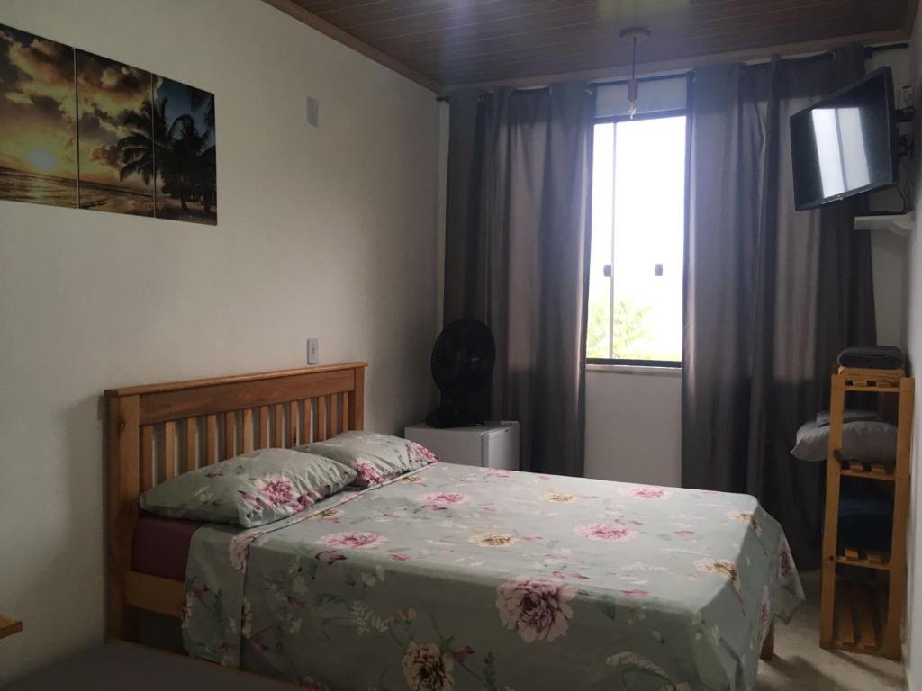 Postel nebo postele na pokoji v ubytování Mar Doce Lar Suítes Trindade