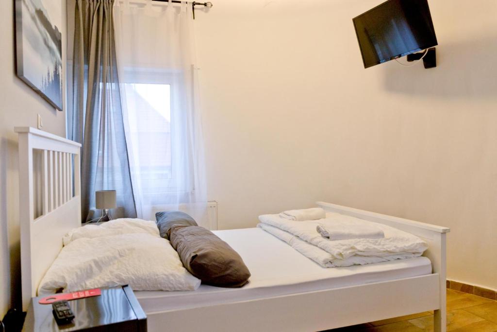 Ein Bett oder Betten in einem Zimmer der Unterkunft Hotel Frankenthaler Hof