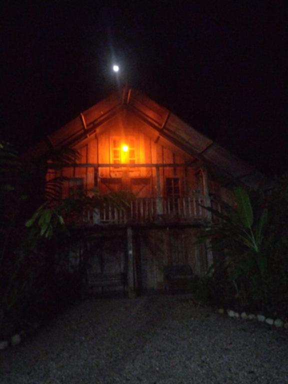 a house at night with the moon on top at Hotel La Gamba Rainforest Lodge in Golfito