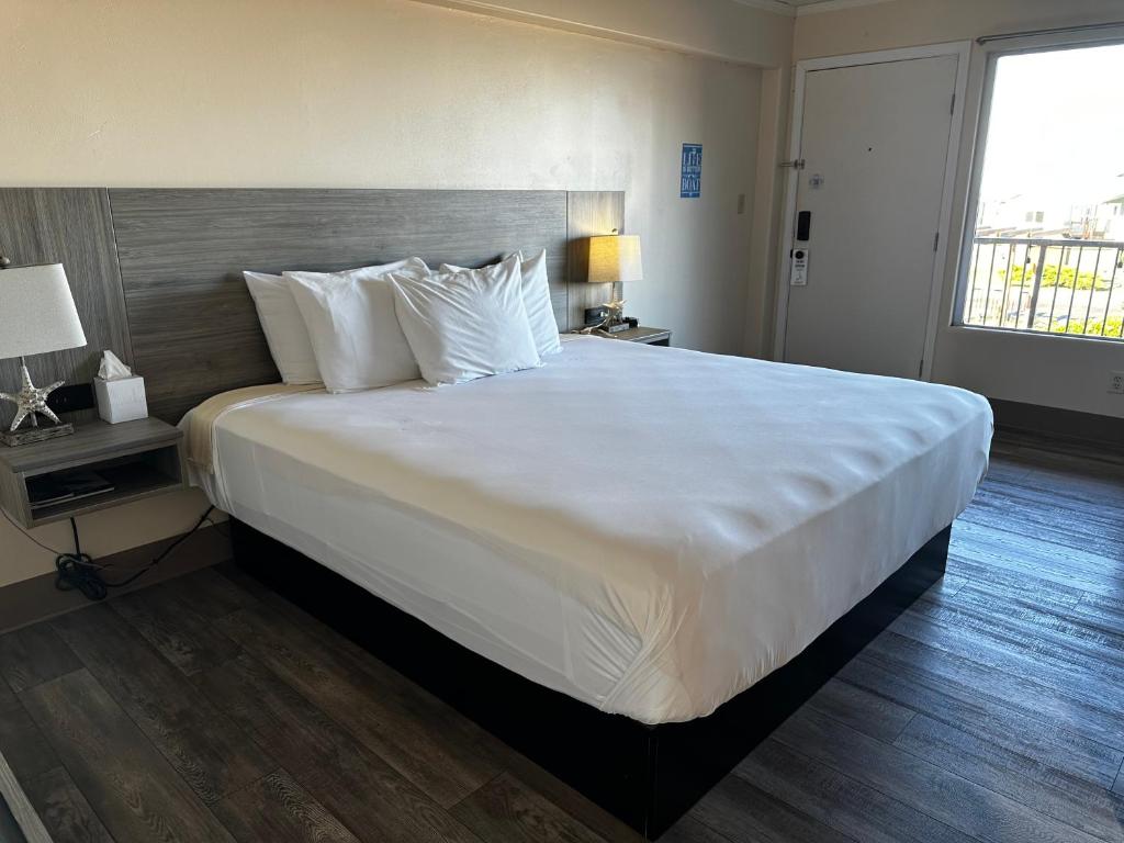 Postel nebo postele na pokoji v ubytování Westport Inn
