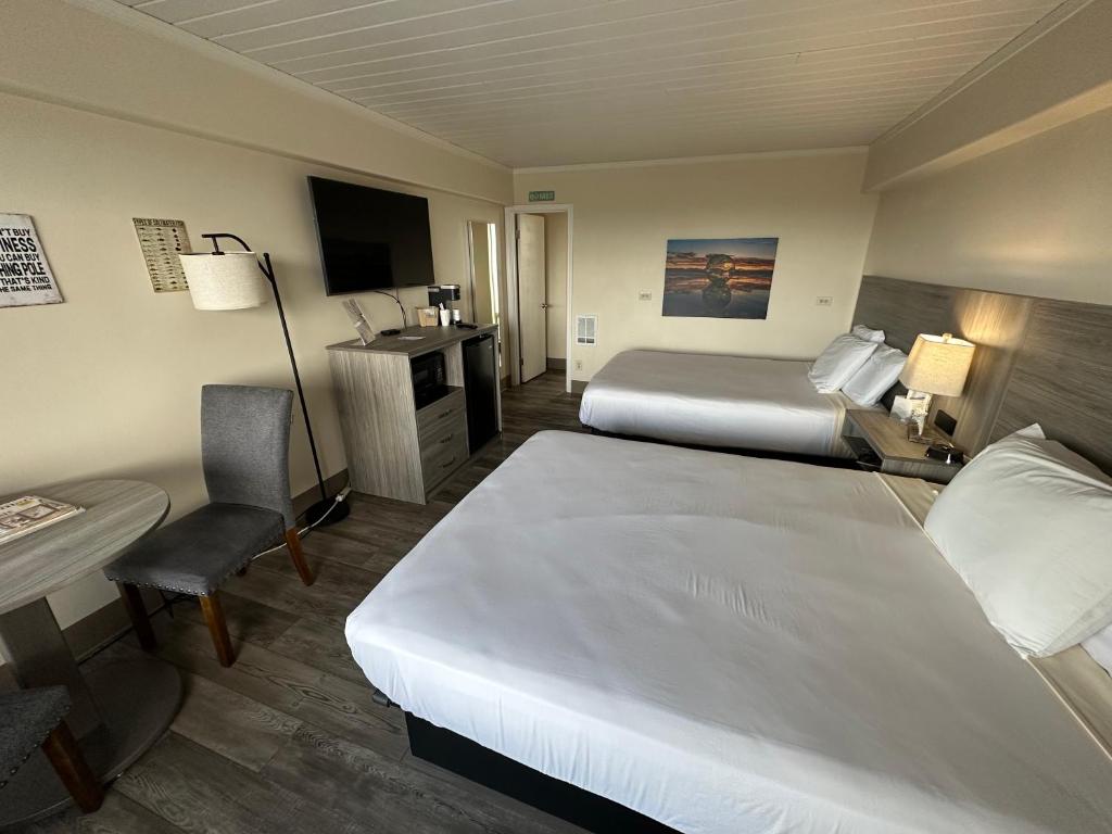 Postel nebo postele na pokoji v ubytování Westport Inn