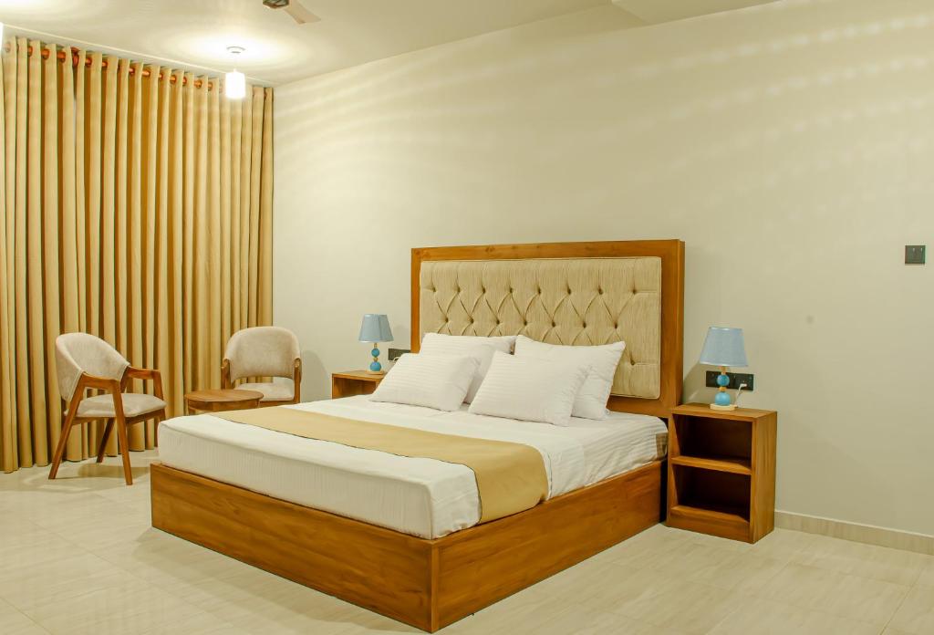 Postel nebo postele na pokoji v ubytování Ivory Resort Dikwella