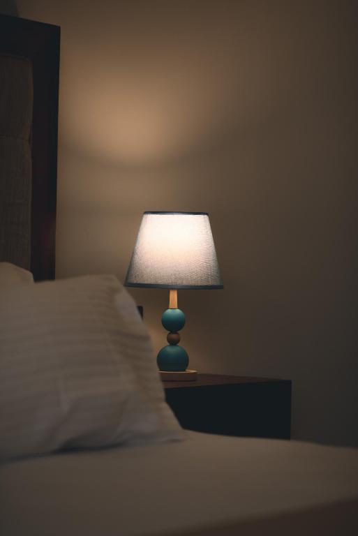 Postel nebo postele na pokoji v ubytování Ivory Resort Dikwella