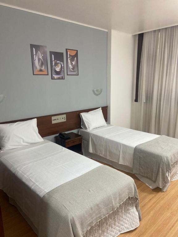 Postel nebo postele na pokoji v ubytování City Hotel by Fast10