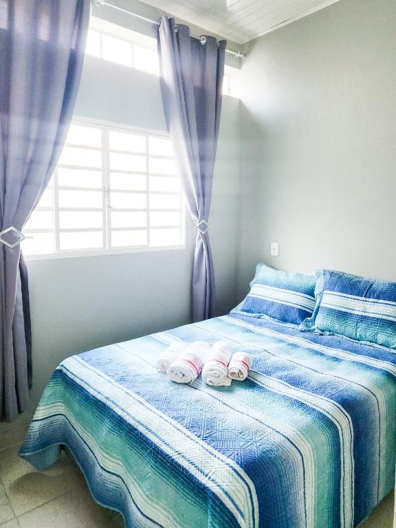 Postel nebo postele na pokoji v ubytování Recanto da paz em Cunha, SP