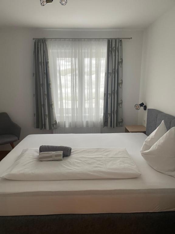 Postel nebo postele na pokoji v ubytování Haus Alpenland