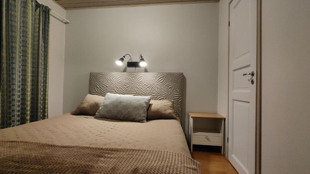 Кровать или кровати в номере Apartments Tahko
