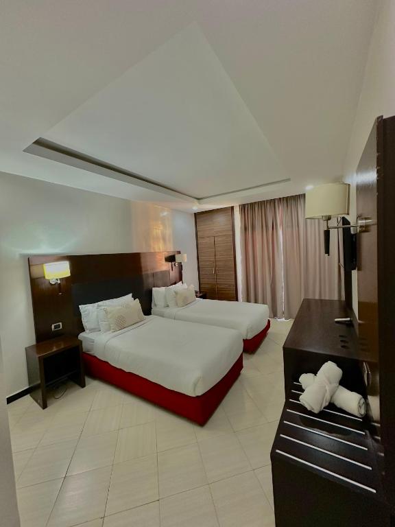 Postel nebo postele na pokoji v ubytování Hotel Oscar 1