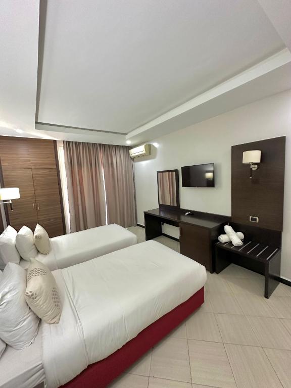 TV a/nebo společenská místnost v ubytování Hotel Oscar 1