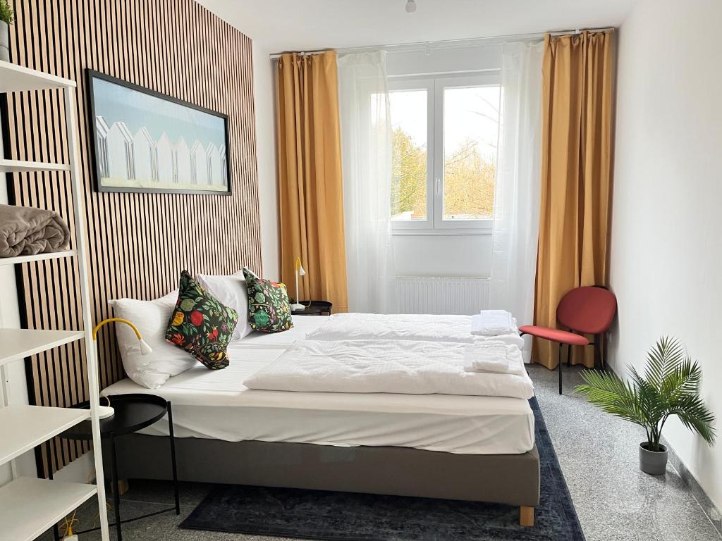Ένα ή περισσότερα κρεβάτια σε δωμάτιο στο LTA Apartment München Süd No1 Fun & Games