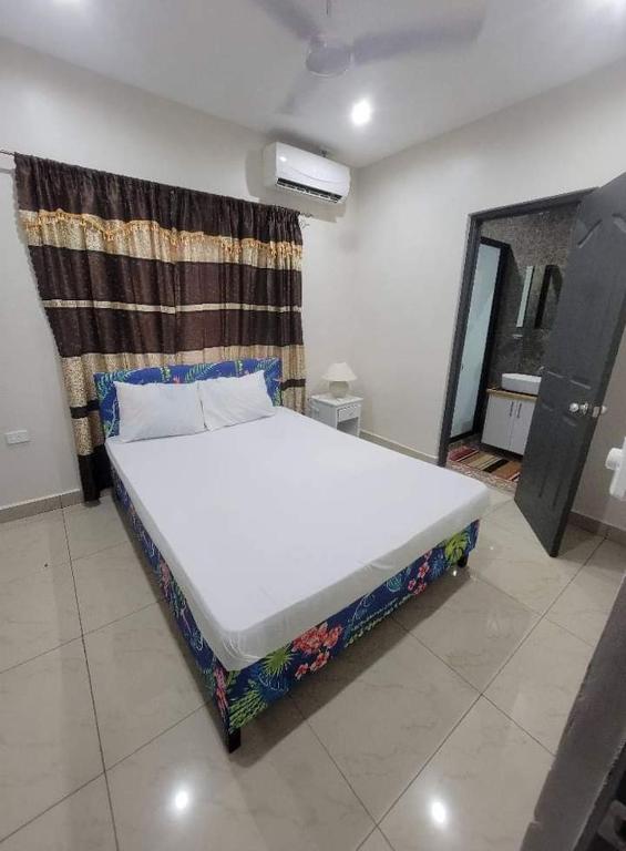 Llit o llits en una habitació de Alis786 Apartment