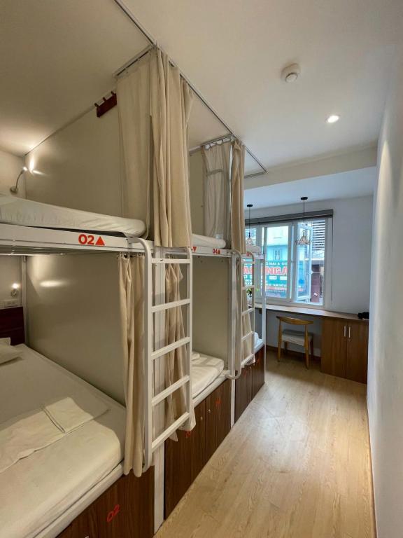 Postel nebo postele na pokoji v ubytování Urban Nest Dormitory