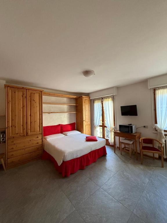 Ένα ή περισσότερα κρεβάτια σε δωμάτιο στο Monolocale/ apartment Caterina