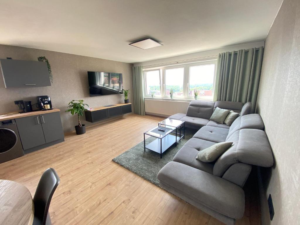 a living room with a couch and a table at Apartment Weitblick in Braunschweig