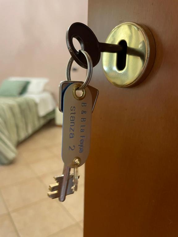 Postel nebo postele na pokoji v ubytování La Feijoa