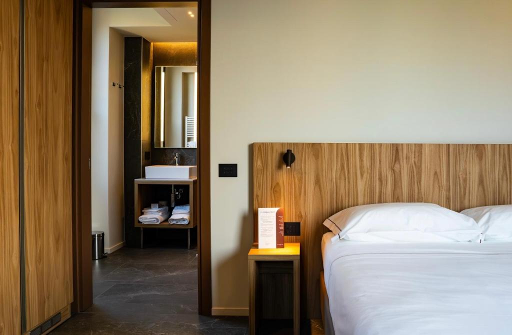 Postel nebo postele na pokoji v ubytování La Molgora Hotel