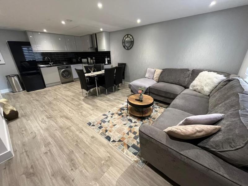 a living room with a couch and a table at Dream flat in Dundry