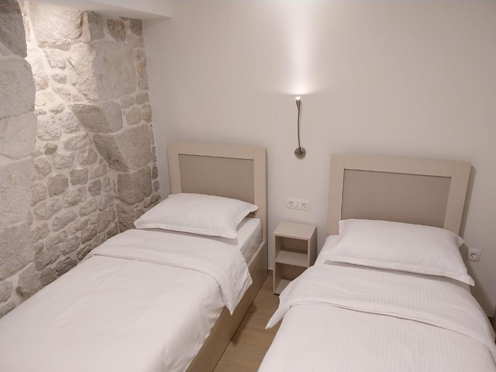Postel nebo postele na pokoji v ubytování Divna
