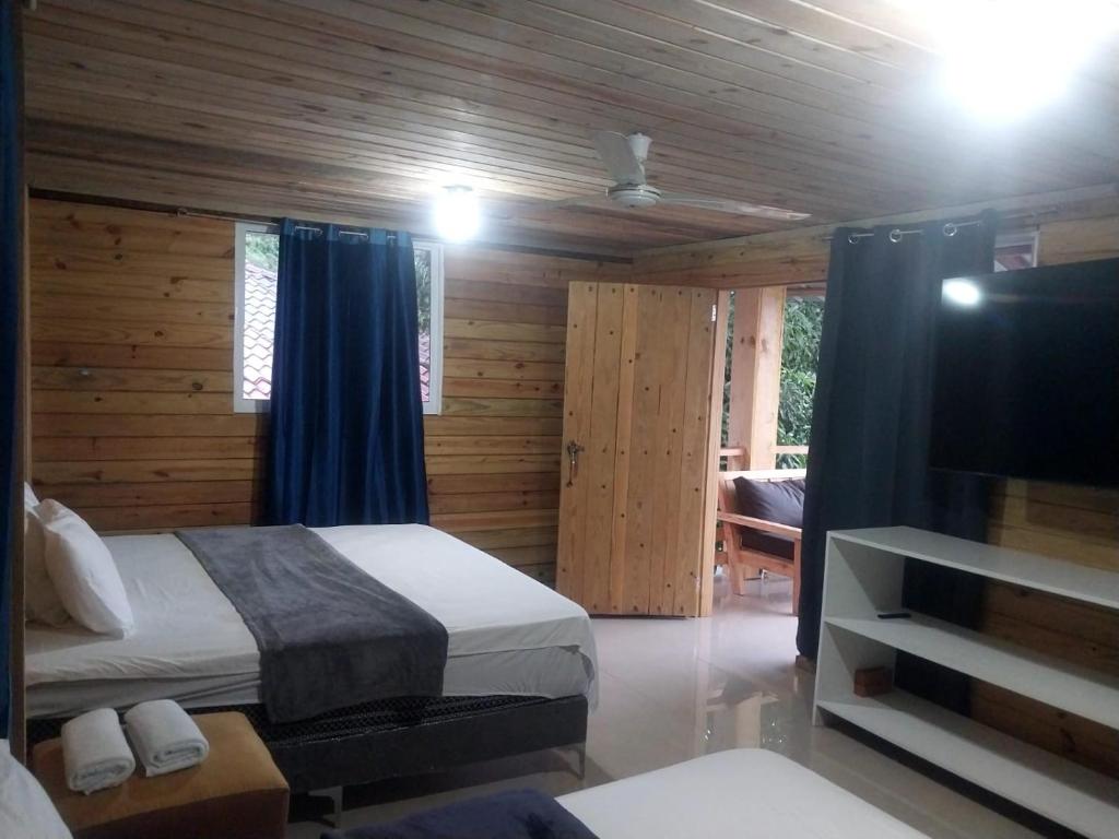 Postel nebo postele na pokoji v ubytování Vista Montaña Jimenoa De La Rosa