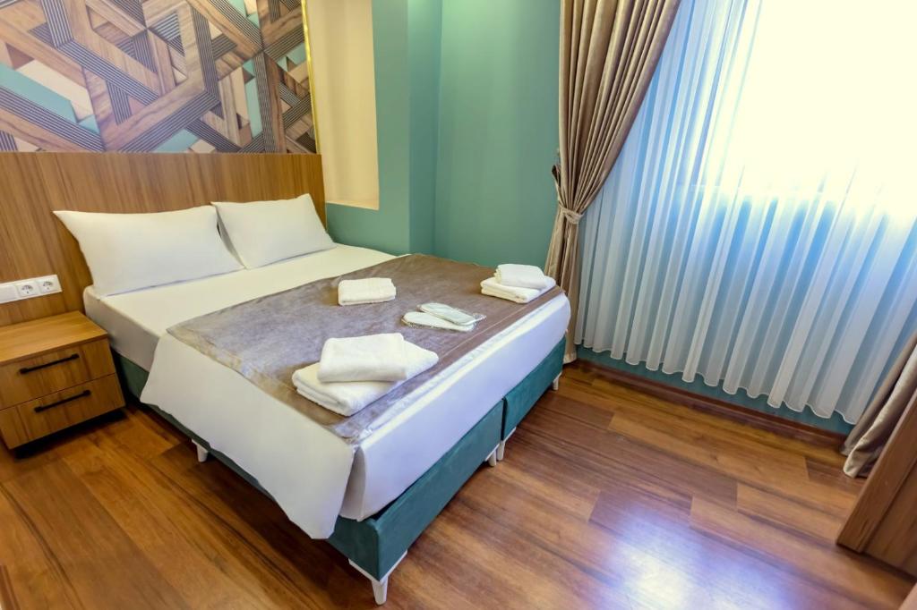 Postel nebo postele na pokoji v ubytování Şişli Of Apartment No 12