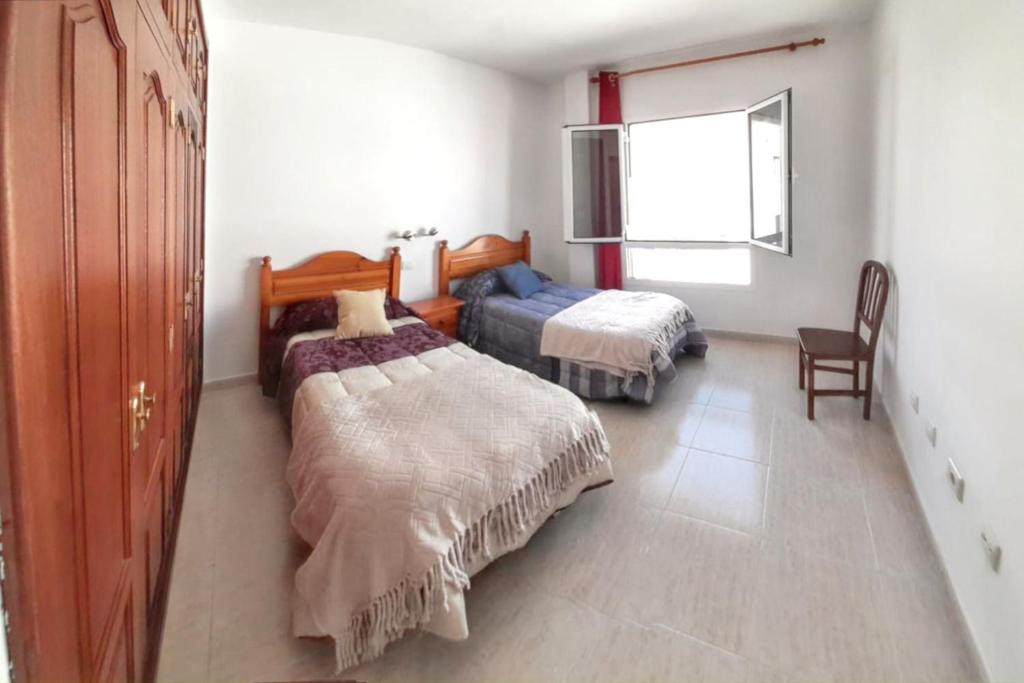 Posteľ alebo postele v izbe v ubytovaní Charming Apartment in Arrecife City Centre - 90 m² - Parking