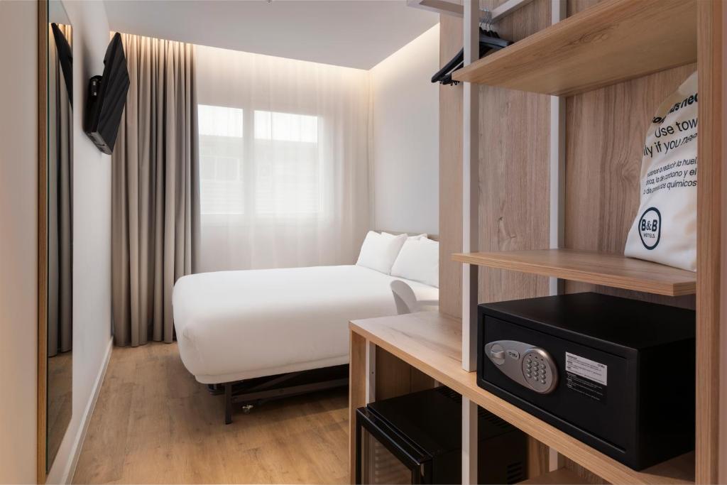 Postel nebo postele na pokoji v ubytování B&B HOTEL Madrid Carabanchel