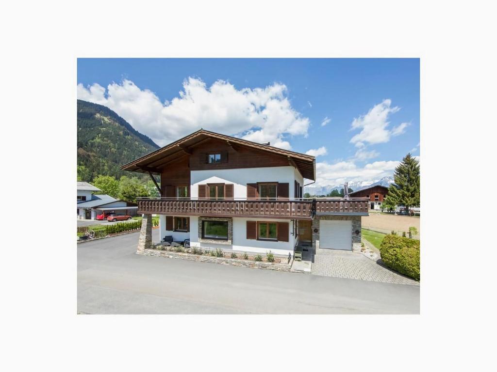 a house in the middle of a parking lot at Holiday home Landhaus Prielau in Maishofen