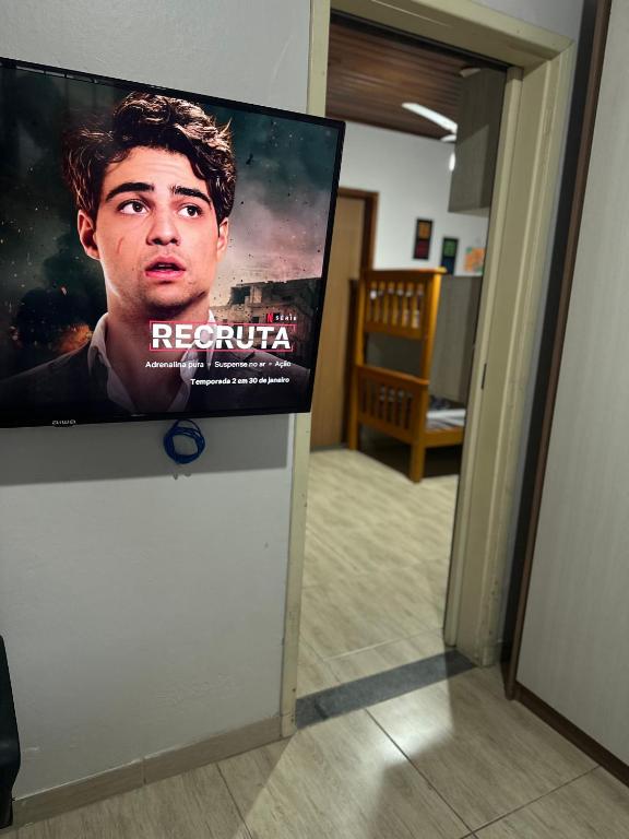 TV a/nebo společenská místnost v ubytování Casa aconchegante