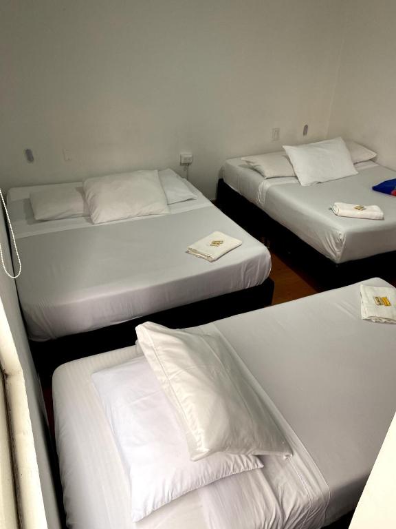 Postel nebo postele na pokoji v ubytování Hotel Quintas de Bogotá
