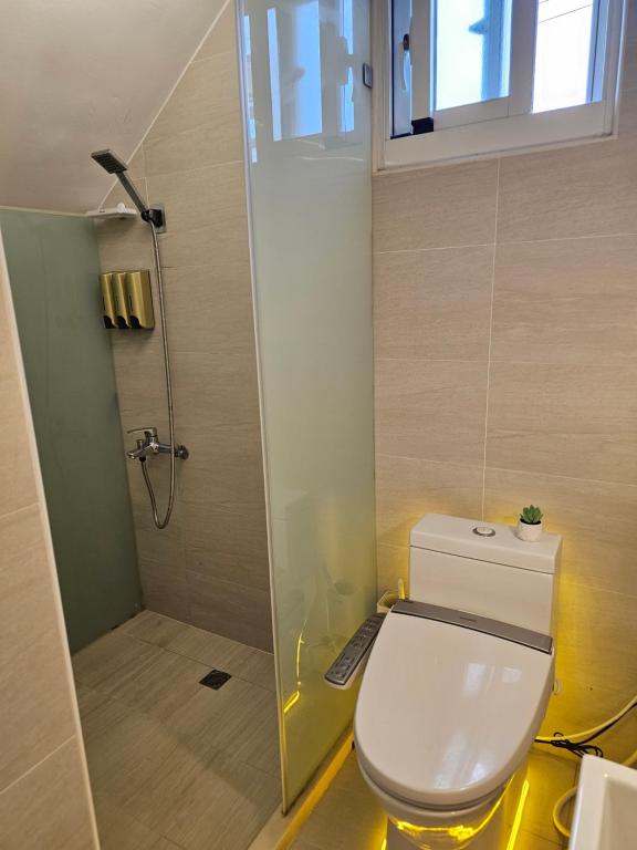Koupelna v ubytování 輕安漫旅電梯民宿