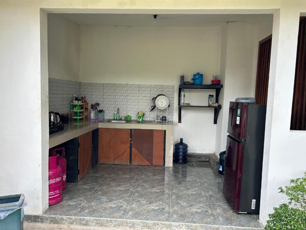 Kuchyň nebo kuchyňský kout v ubytování Sayang Bungalows